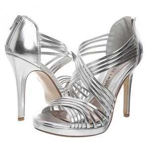 Silver, high heels brand new size 7.5